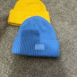 L’ Eternite yellow and blue beanie hats